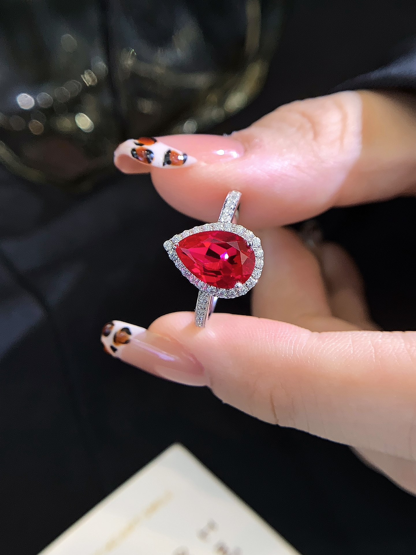 6x9mm Pear Cut Ruby 18K Gold Halo Engagement Ring